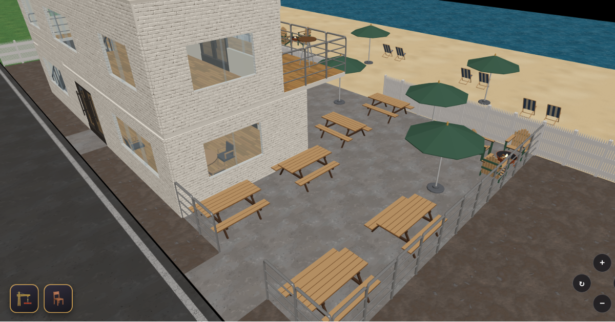 A seaside bar overlooking the ocean with an expansive patio and beach chairs